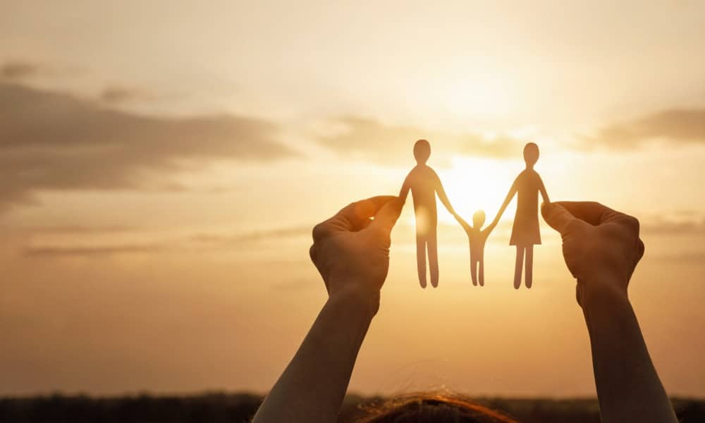 Do I need a custody lawyer in Los Angeles portrayed by a paper cut out of a family held up to the sun.