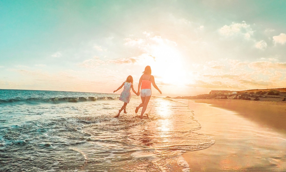 Family Attorneys in Los Angeles The Sands Law Group portayed by a mother and daughter on a California beach